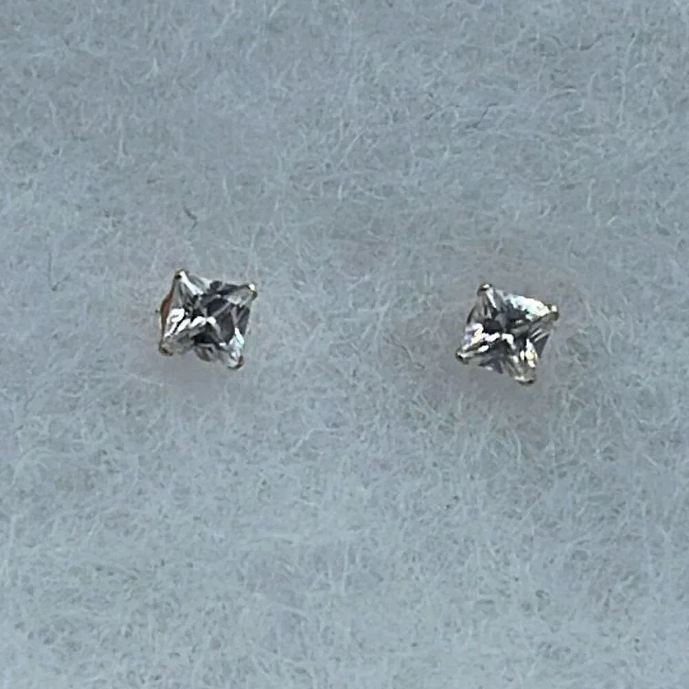 14K JCM CZ stud earrings.